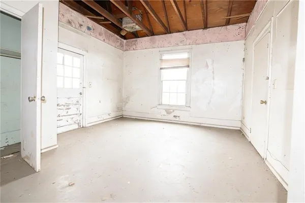 an empty room with windows