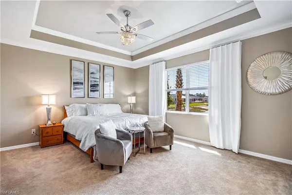 a bedroom with bed and window