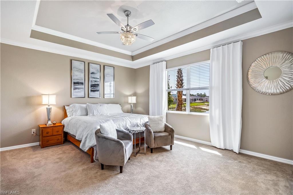 43693 Tree Top Trail Babcock Ranch, FL 33982 - Photo 13 of 25 a bedroom with bed and window