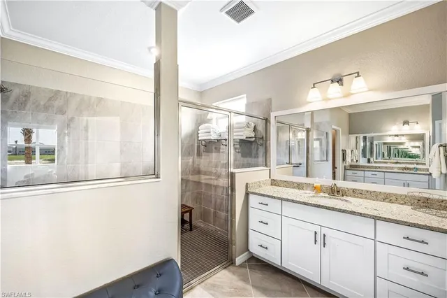 a bathroom with a granite countertop sink mirror and