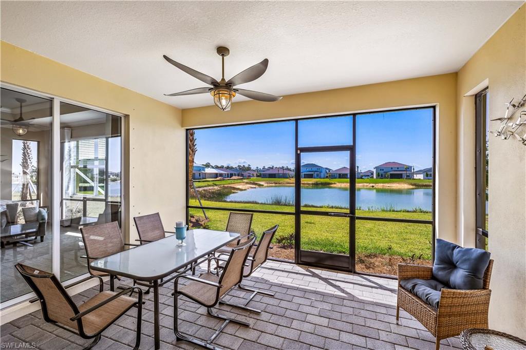 43693 Tree Top Trail Babcock Ranch, FL 33982 - Photo 23 of 25 a view of a dining room with furniture window and outside view