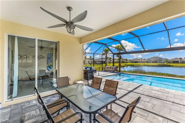 a view of a patio with a table and chairs