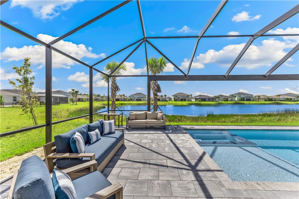 43693 Tree Top Trail Babcock Ranch, FL 33982 - Photo 3 of 25 a view of swimming pool with seating area and furniture