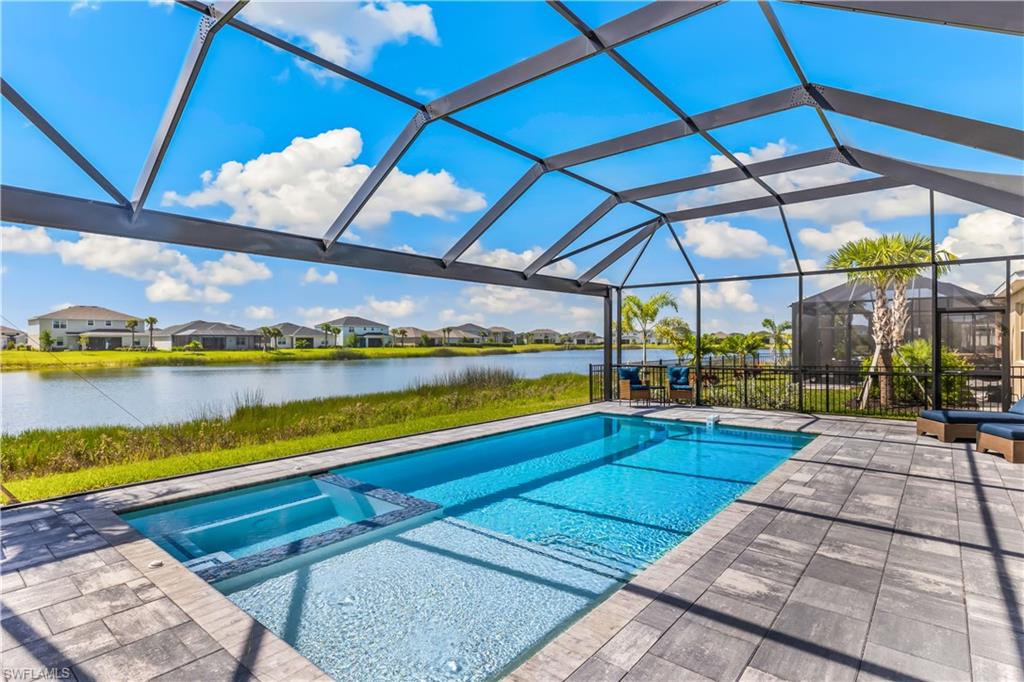 43693 Tree Top Trail Babcock Ranch, FL 33982 - Photo 4 of 25 a view of a swimming pool with a patio