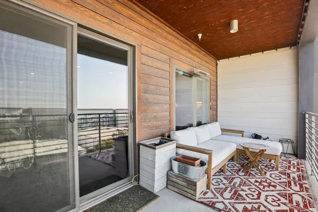 a backyard of a house with outdoor seating