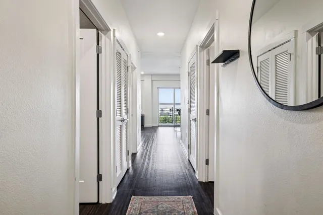 a living room with furniture a wooden floor and chandelier