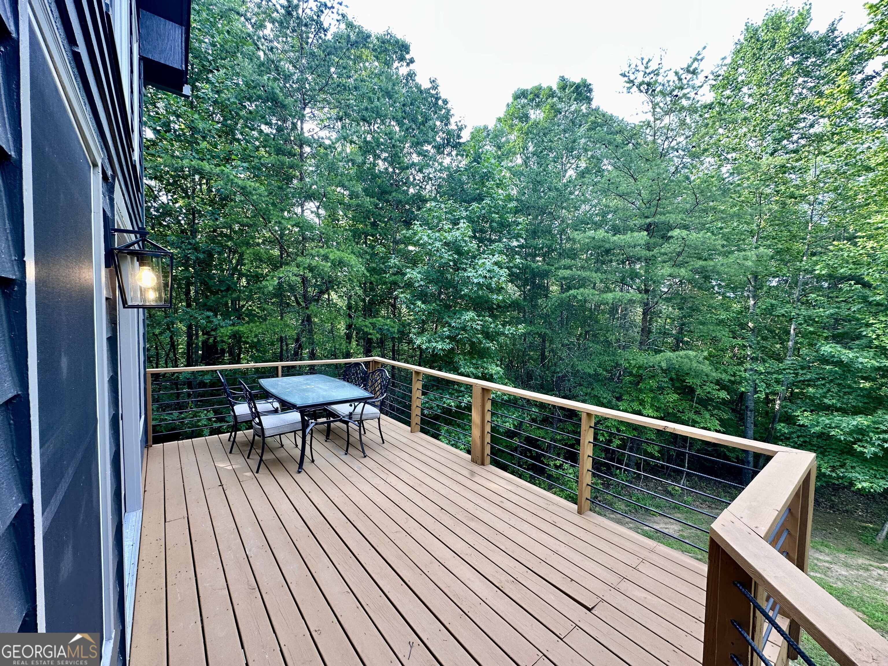 2769 Bean Creek Road Sautee Nacoochee, GA 30571 - Photo 27 of 33 a view of balcony with seating and trees
