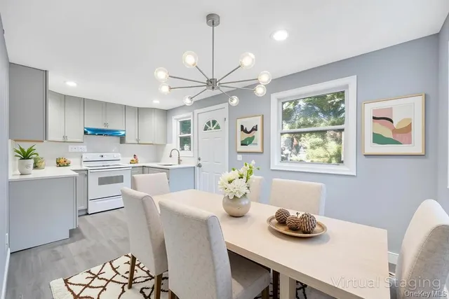 a kitchen with a table chairs stove and microwave