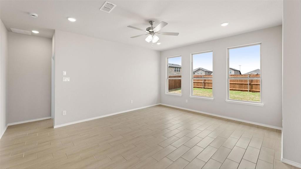 361 Deer Rdg Drive Aledo, TX 76008 - Photo 14 of 25 an empty room with windows and ceiling fan