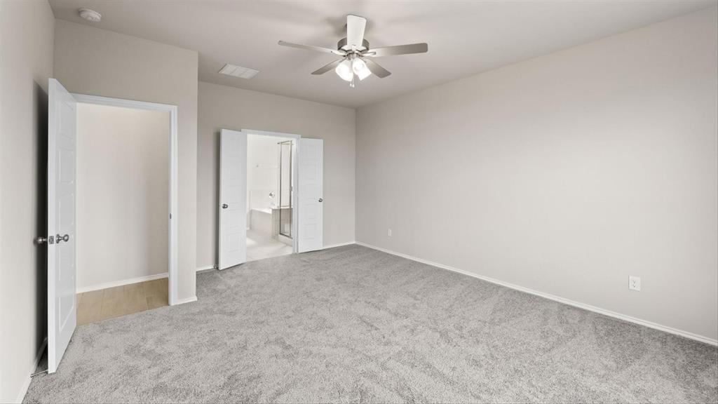 361 Deer Rdg Drive Aledo, TX 76008 - Photo 15 of 25 an empty room with a ceiling fan and a window