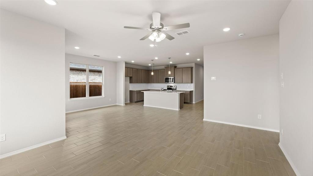 361 Deer Rdg Drive Aledo, TX 76008 - Photo 12 of 25 a view of a kitchen with a sink and a stove