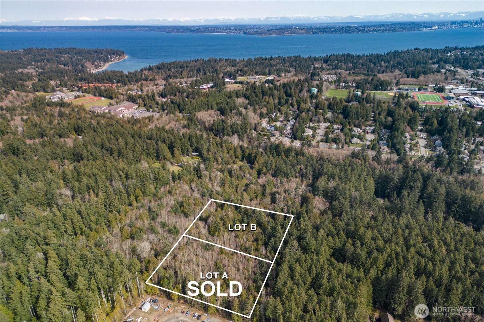 8679 Northeast Fox Den Lane, Unit LOT B Bainbridge Island, WA 98110 - Photo 6 of 12 a view of city and mountain