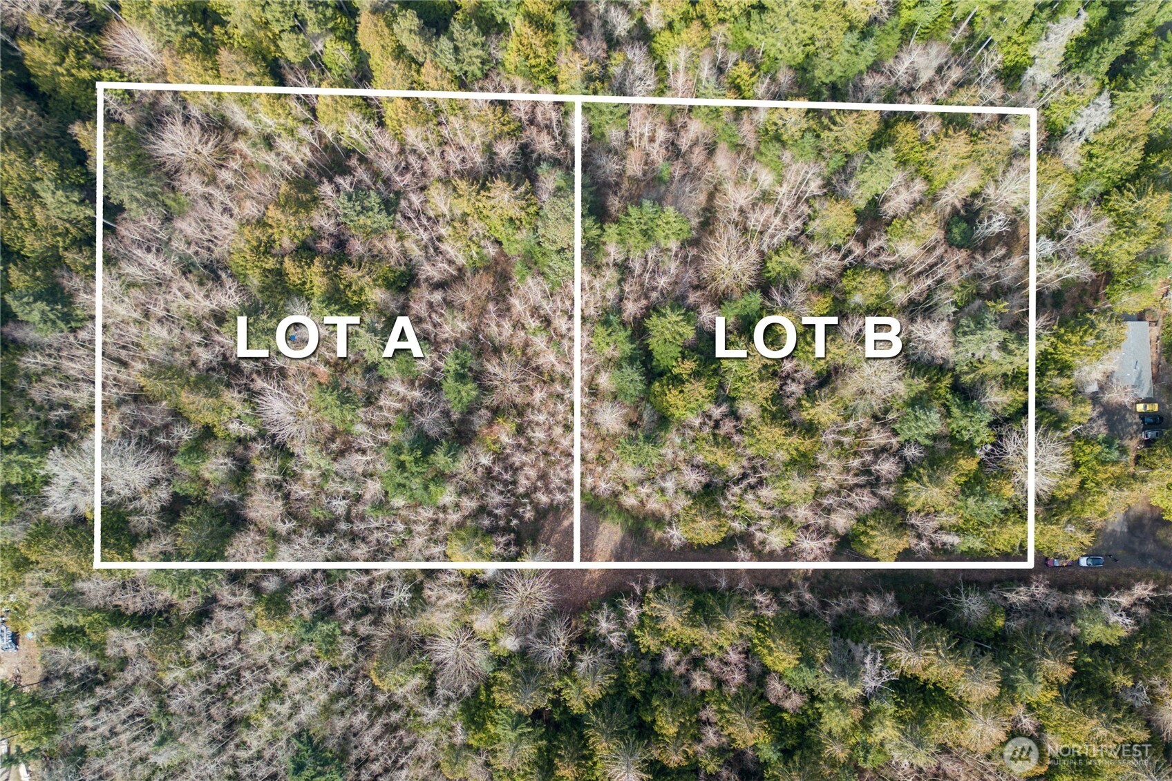 8679 Northeast Fox Den Lane, Unit LOT B Bainbridge Island, WA 98110 - Photo 7 of 12 a view of a wooden fence and a street view
