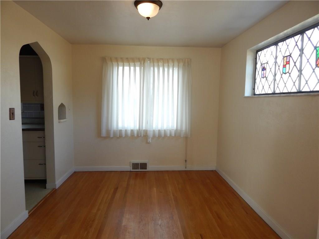 2009 Mohawk Road Upper St. Clair, PA 15241 - Photo 4 of 15 DINING ROOM - Adjacent to kitchen, arched doorway, hardwood floor