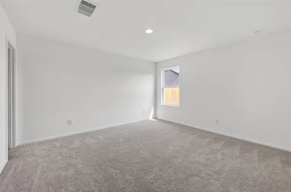 an empty room with a empty space and a window