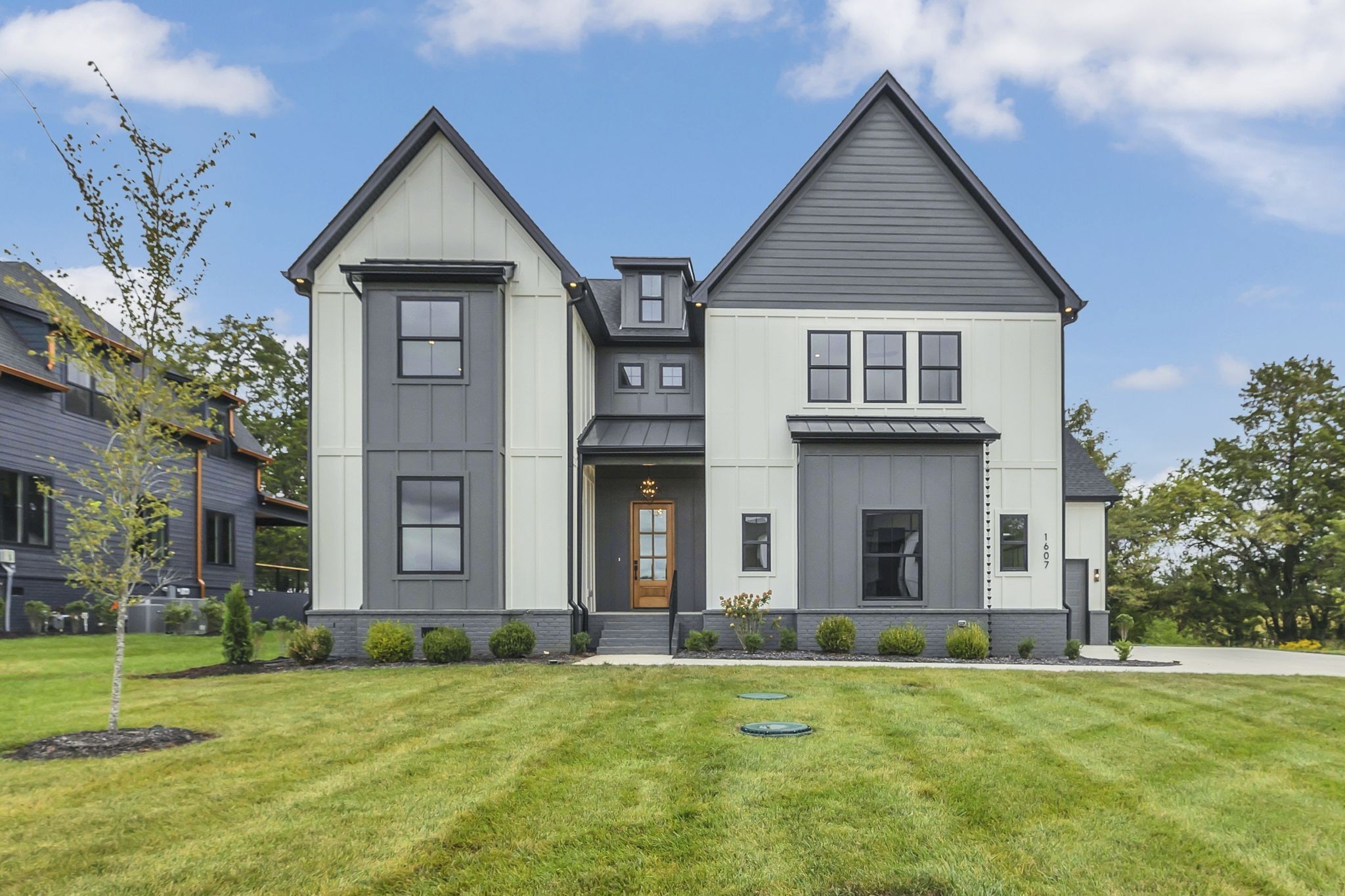 1607 Martha Washington Way Murfreesboro, TN 37130 - Photo 2 of 43 a front view of a house with a yard