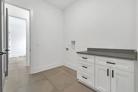 a bathroom with a double vanity sink and mirror with shower