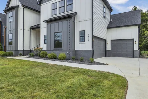 a front view of a house with garage