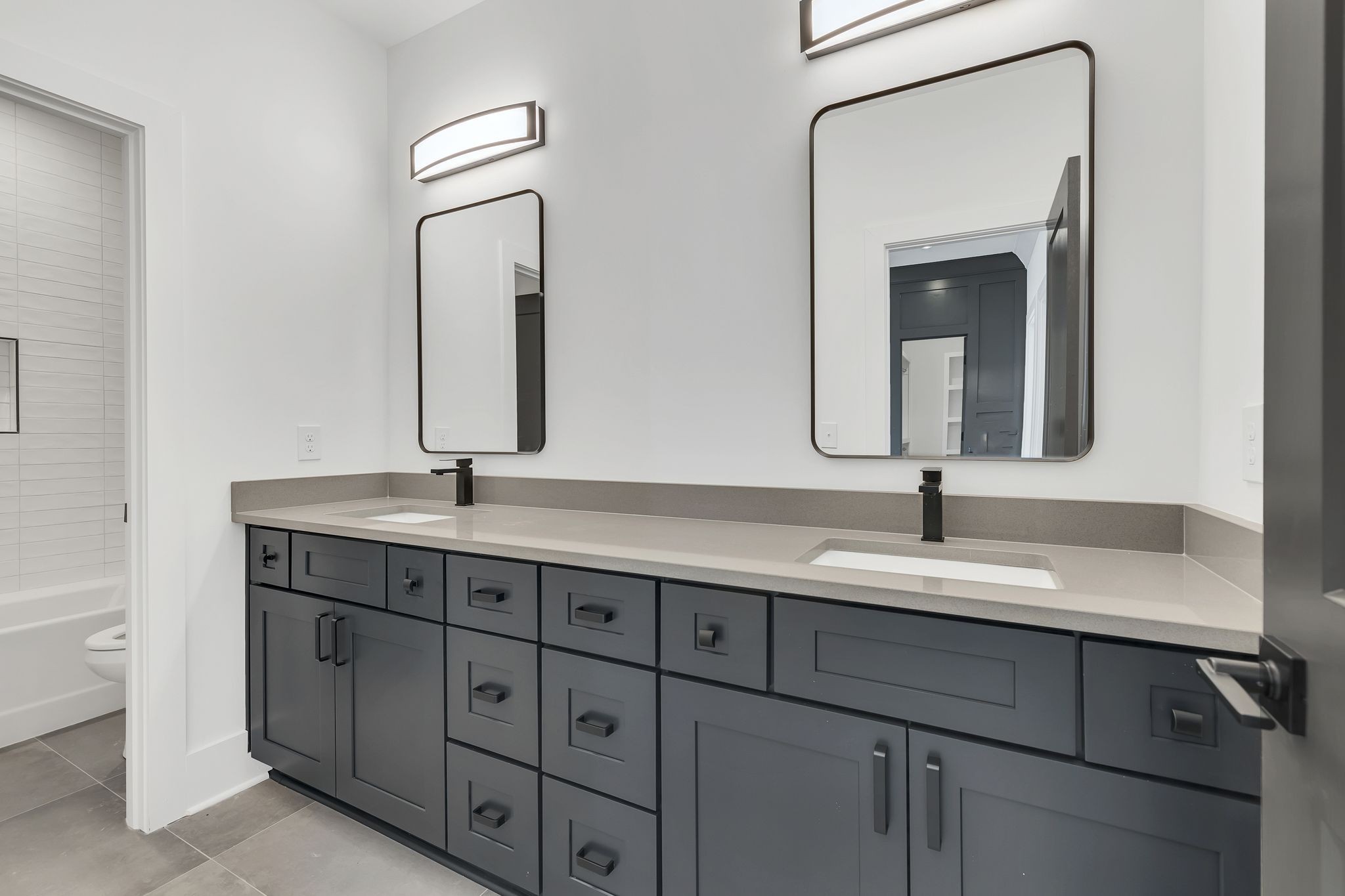 1607 Martha Washington Way Murfreesboro, TN 37130 - Photo 35 of 43 a bathroom with a double vanity sink and a mirror