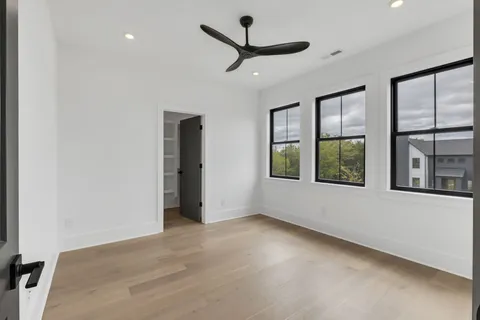 a view of a livingroom with an empty space and a window