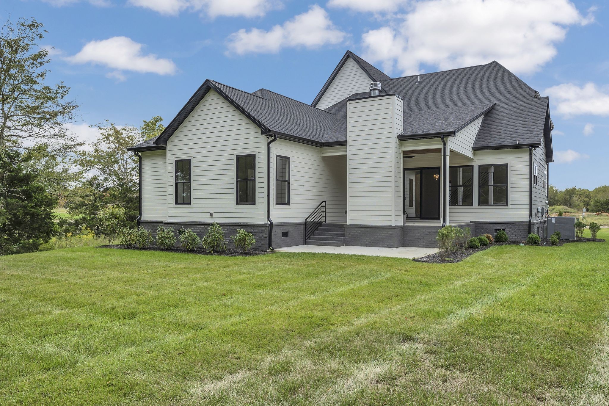 1607 Martha Washington Way Murfreesboro, TN 37130 - Photo 42 of 43 a front view of a house with a yard and garage