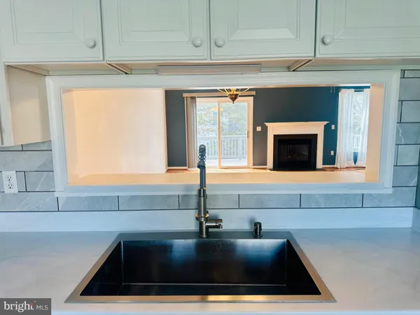 a view of kitchen with wooden floor