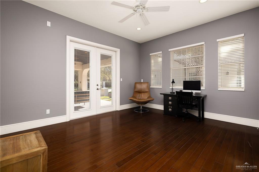 8901 North 2nd Street McAllen, TX 78504 - Photo 19 of 40 Bedroom 3 with French doors open to fireplace courtyard