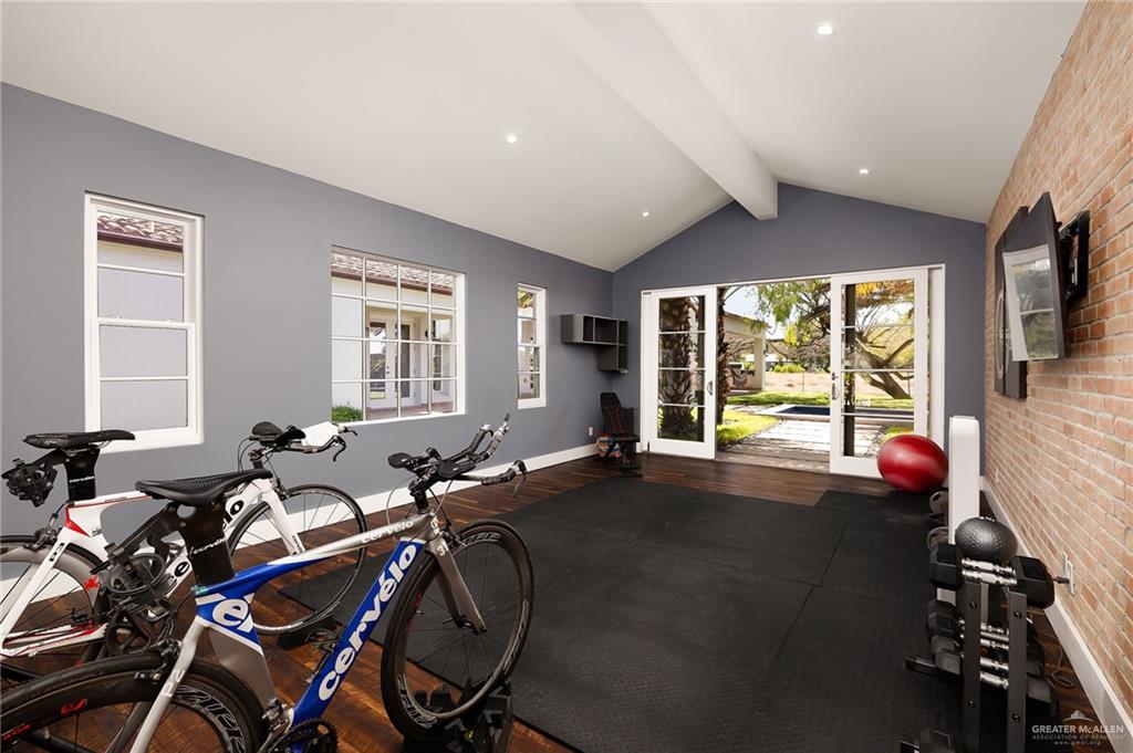8901 North 2nd Street McAllen, TX 78504 - Photo 28 of 40 Currently used as a great gym with motivating views, this is the 5th bedroom in the house.
