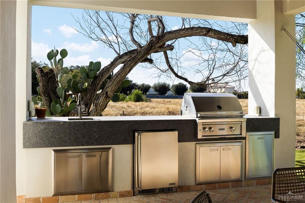 8901 North 2nd Street McAllen, TX 78504 - Photo 34 of 40 Even the outdoor kitchen is luxury! With a Jynx grill, lighted refrigerator, warming oven and sink!