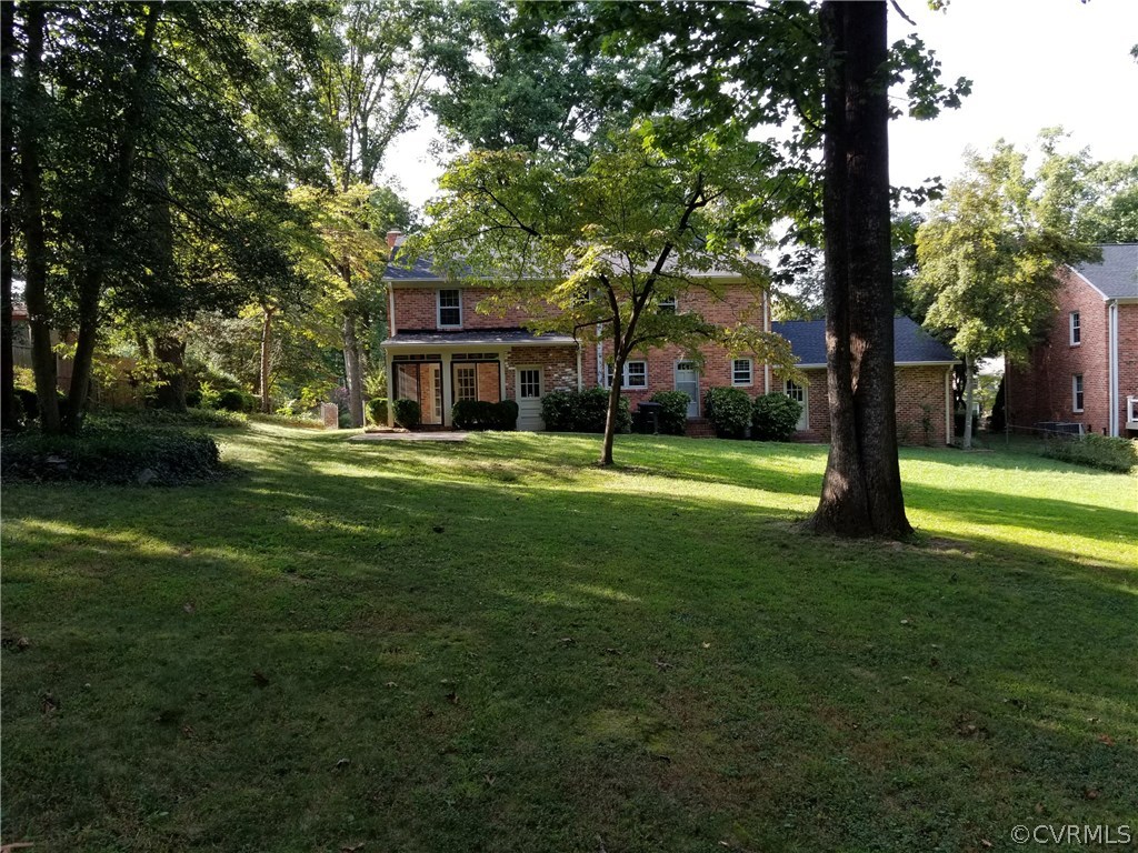 4117 Cresthill Road Chester, VA 23831 - Photo 11 of 40 a view of a house with a big yard and large trees