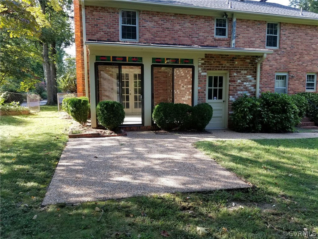 4117 Cresthill Road Chester, VA 23831 - Photo 12 of 40 a view of a brick building next to a yard