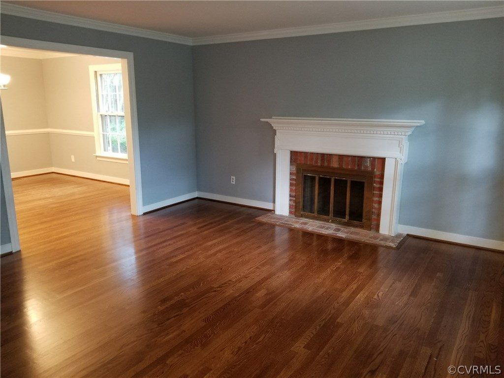 4117 Cresthill Road Chester, VA 23831 - Photo 20 of 40 an empty room with wooden floor fireplace and windows