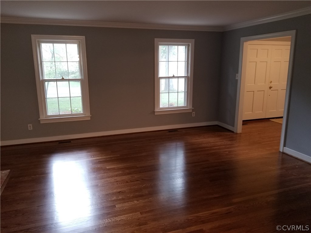 4117 Cresthill Road Chester, VA 23831 - Photo 23 of 40 an empty room with wooden floor and windows