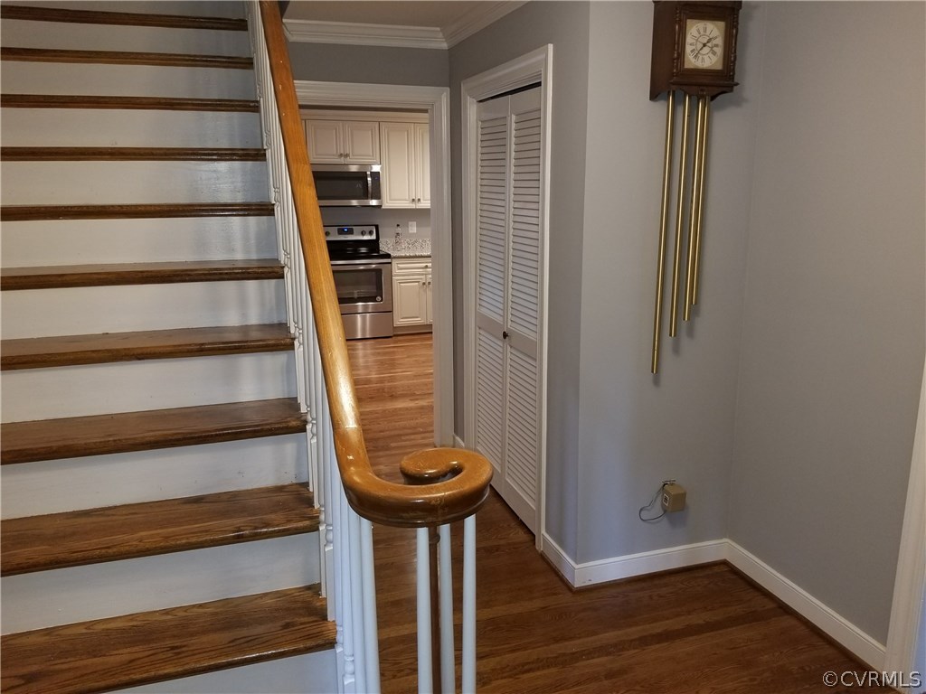 4117 Cresthill Road Chester, VA 23831 - Photo 24 of 40 a view of a hallway with wooden floor and staircase
