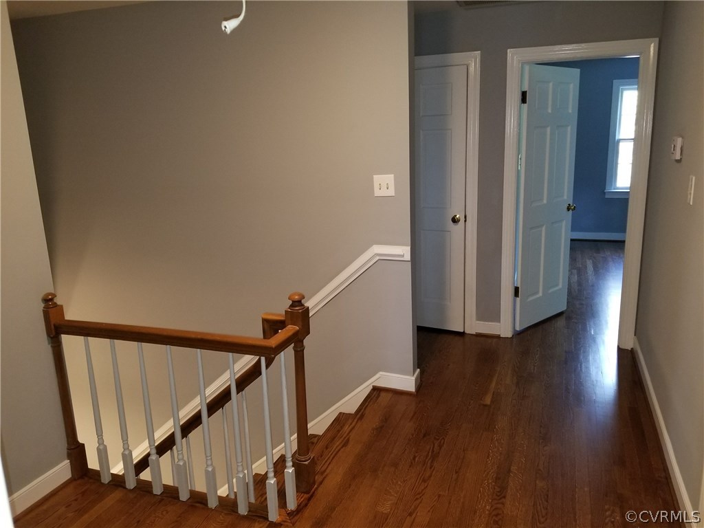 4117 Cresthill Road Chester, VA 23831 - Photo 27 of 40 a view of a hallway with wooden floor and stairs