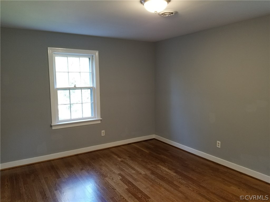 4117 Cresthill Road Chester, VA 23831 - Photo 36 of 40 an empty room with wooden floor and windows