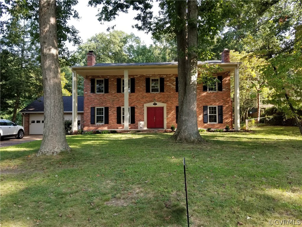 4117 Cresthill Road Chester, VA 23831 - Photo 5 of 40 a view of house with outdoor space and garden