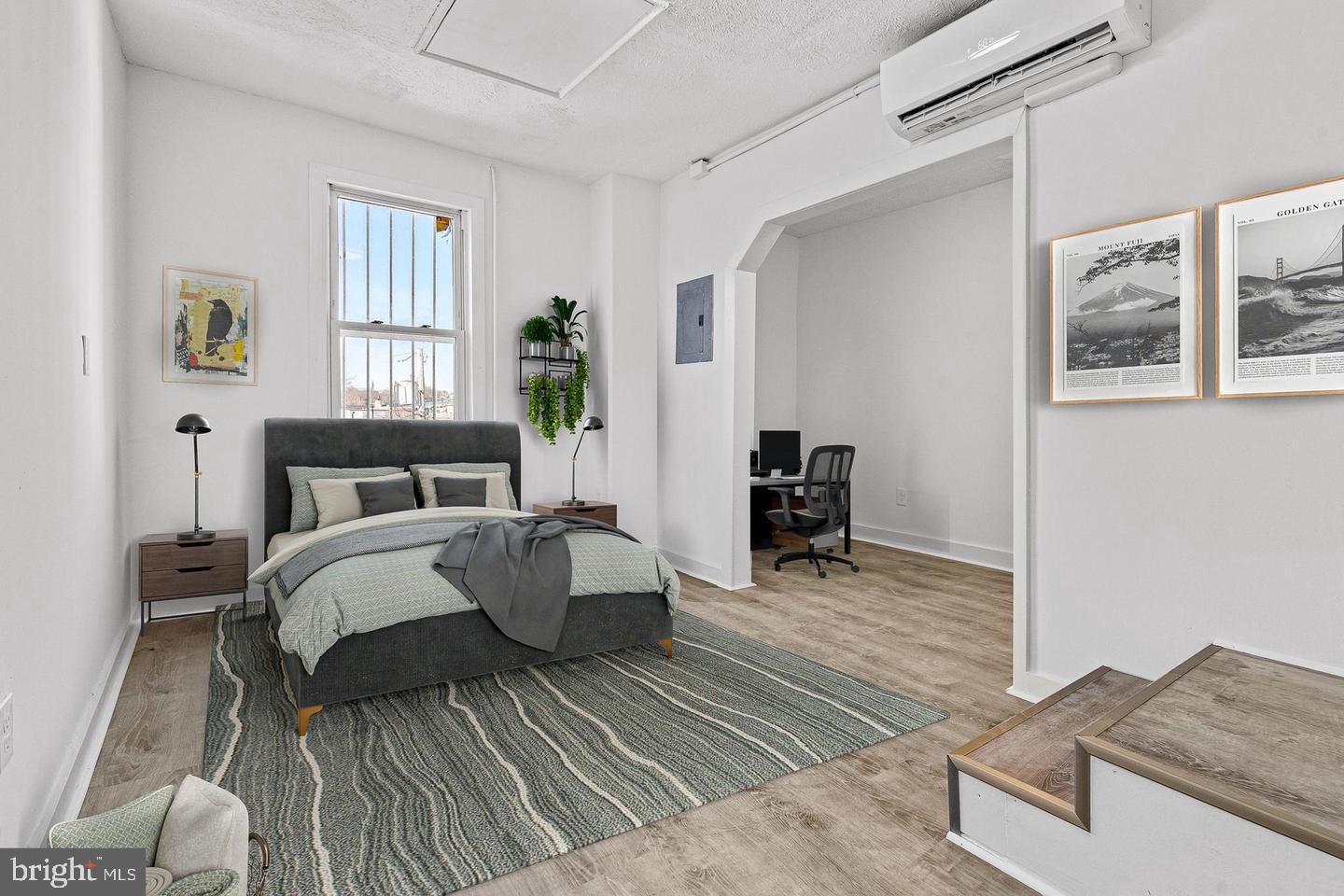 1308 West Lexington Street, Unit 3R Baltimore, MD 21223 - Photo 1 of 16 a bedroom with a bed and a dresser next to a window