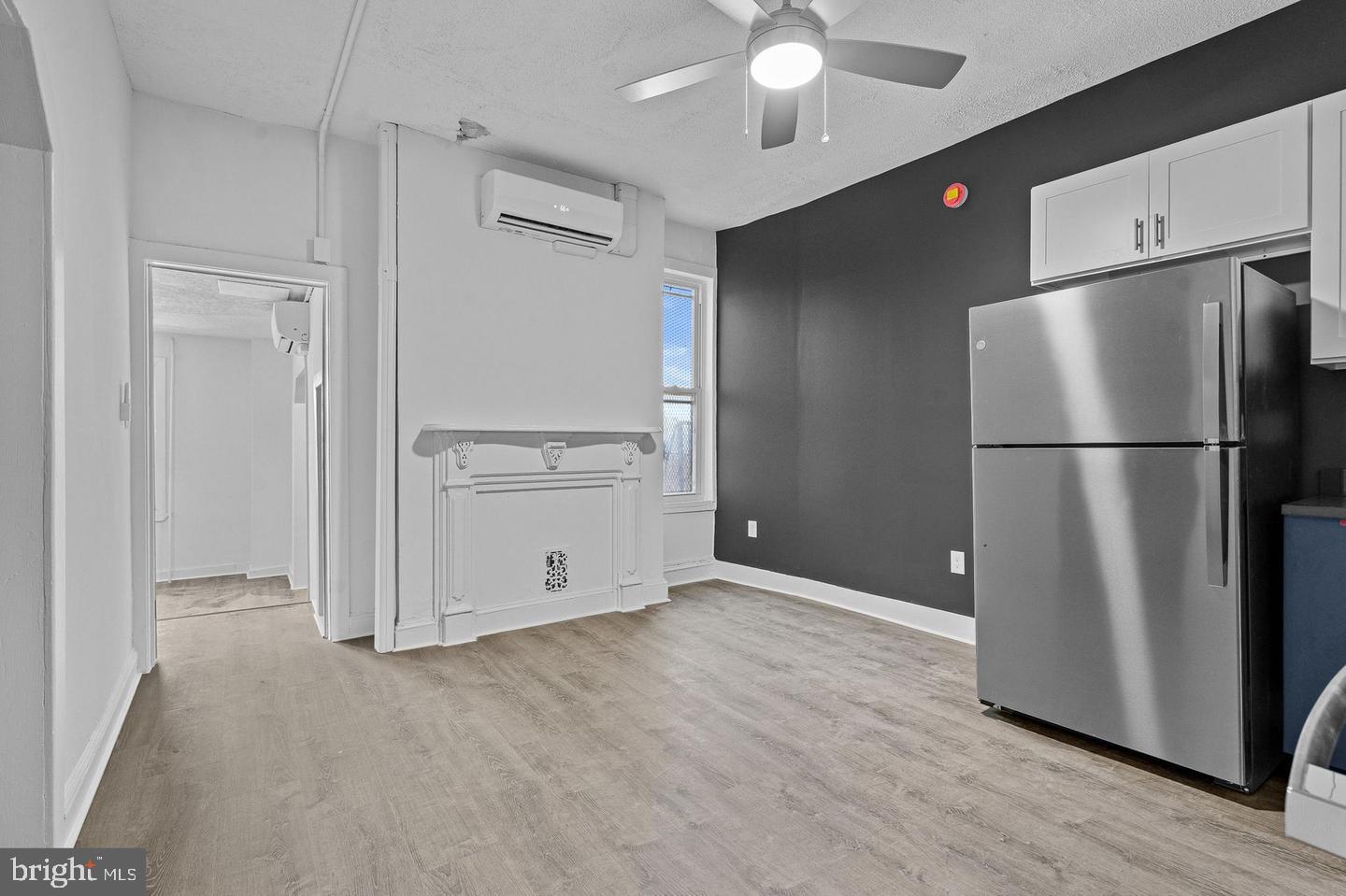 1308 West Lexington Street, Unit 3R Baltimore, MD 21223 - Photo 3 of 16 a view of a kitchen with a refrigerator and a stove top oven