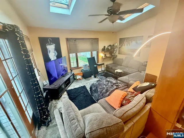 a living room with furniture fireplace and a flat screen tv