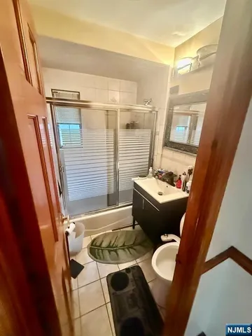 a view of a room with gym equipment and a window