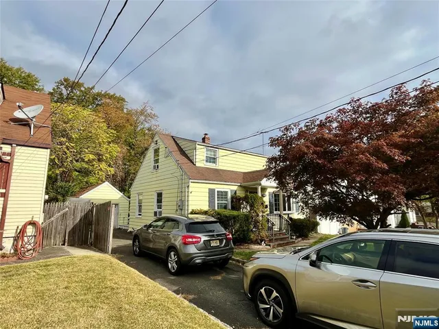 a car parked in front of a house