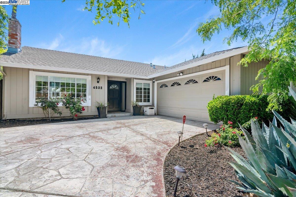 a house with a yard and garage