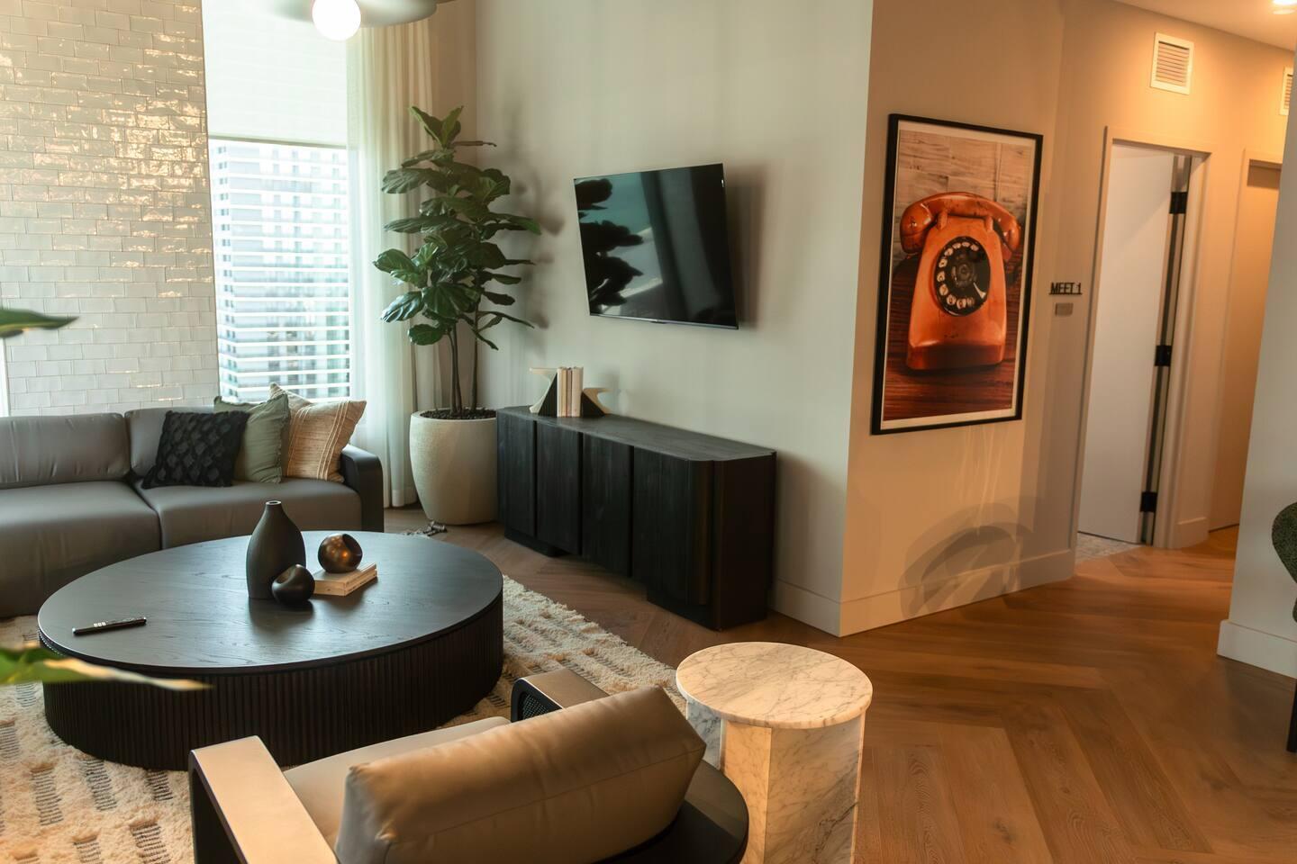 121 Northeast 5th Street Miami, FL 33132 - Photo 8 of 26 a living room with furniture and a potted plant
