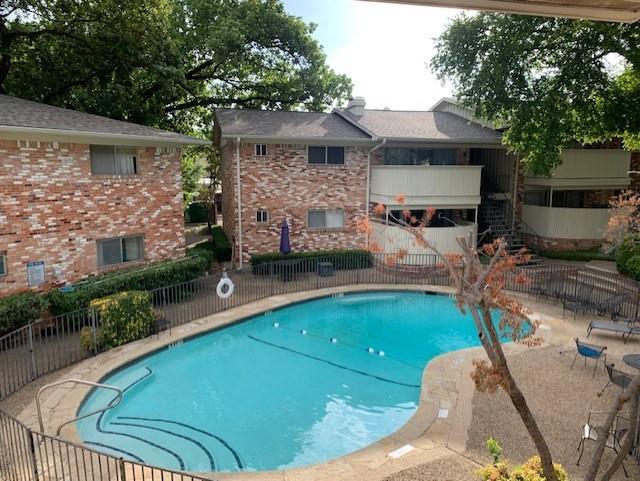 7812 Royal Lane, Unit 210 Dallas, TX 75230 - Photo 17 of 23 a swimming pool with outdoor seating and yard