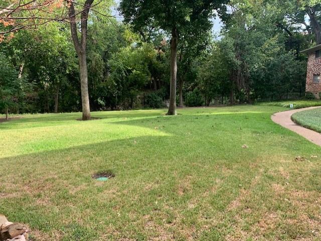 7812 Royal Lane, Unit 210 Dallas, TX 75230 - Photo 19 of 23 a view of a field with a tree