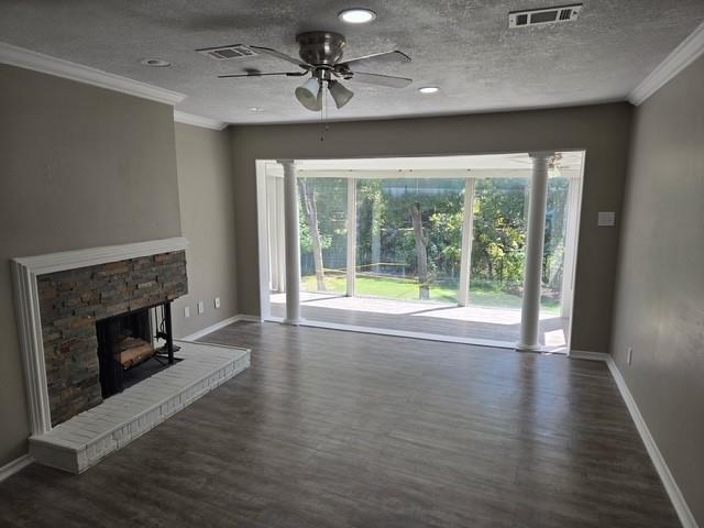 7812 Royal Lane, Unit 210 Dallas, TX 75230 - Photo 2 of 23 a view of an empty room with wooden floor fireplace and a window