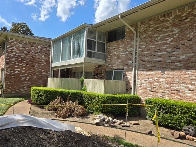 7812 Royal Lane, Unit 210 Dallas, TX 75230 - Photo 21 of 23 a front view of a house with garden