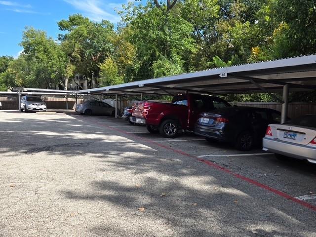 7812 Royal Lane, Unit 210 Dallas, TX 75230 - Photo 22 of 23 a view of car parking
