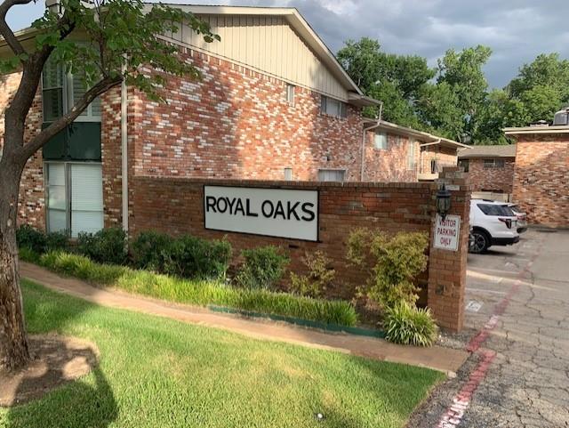 7812 Royal Lane, Unit 210 Dallas, TX 75230 - Photo 23 of 23 a view of outdoor space with garden and signage